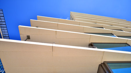 Downtown corporate business district architecture. Glass reflective office buildings against blue sky and sun light. Economy, finance, business activity concept. Abstract modern aの写真素材