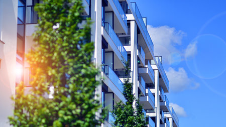 Modern apartment buildings on a sunny day with a blue sky. Facade of a modern apartment building....