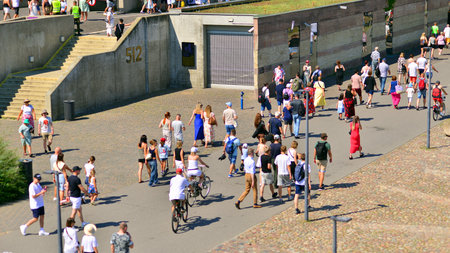 Warsaw, Poland. 15 August 2025. Tourists and residents crossing promenade along the Vistula river...