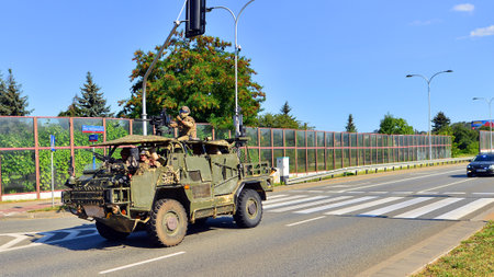 Warsaw, Poland. August 15, 2025. Polish army military convoy. Wheeled armored vehicles drive on...