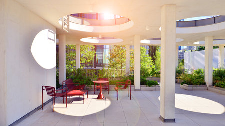 Modern luxury office building.The structure features a glass and concrete walls, showcasing contemporary architecture. The green surroundings of office buildings. Trees and shrubsの写真素材