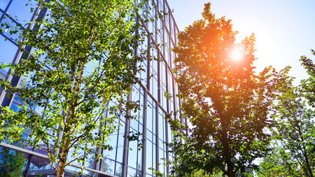 Modern luxury office building.The structure features a glass and concrete walls, showcasing...