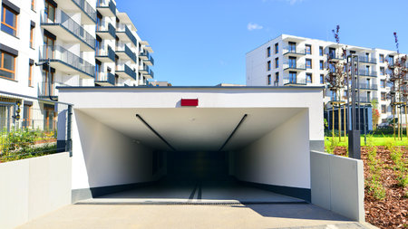 New modern residential apartment house building, garage parking concept.の写真素材