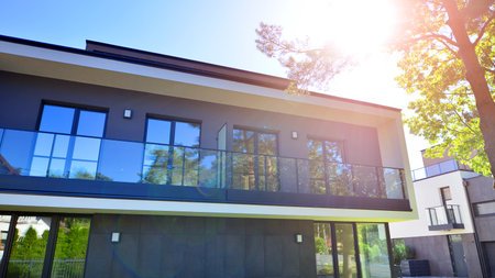 New single family houses in a new development area. Residential homes with modern facade. Terraced family homes in newly developed housing estate. The real estate market in the subの写真素材