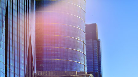 Exterior of modern high-rise buildings in a business district. Tall office buildings. Glass-fronted skyscrapers. Modern business district.の写真素材