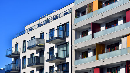 Modern luxury residential apartment. Modern apartment building on a sunny day. Apartment building with a blue sky. Facade of a modern apartment building.の写真素材