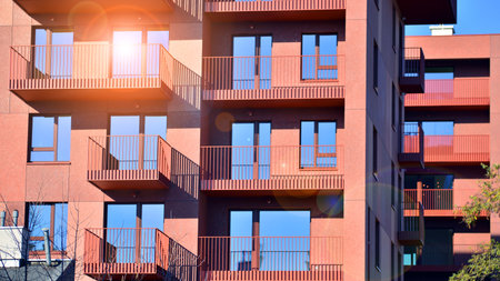 Modern luxury residential apartment. Modern apartment building on a sunny day. Apartment building with a blue sky. Facade of a modern apartment building.の写真素材