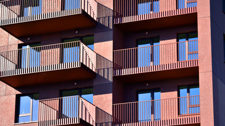 Modern luxury residential apartment. Modern apartment building on a sunny day. Apartment building with a blue sky. Facade of a modern apartment building.の写真素材