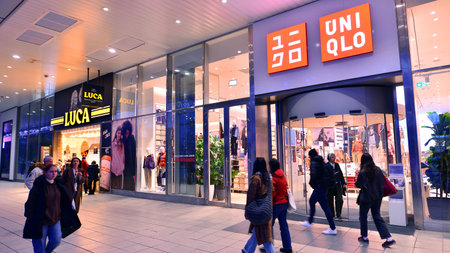Warsaw, Poland. 4 November 2025. People walk along the sidewalks in the vicinity of large shop...
