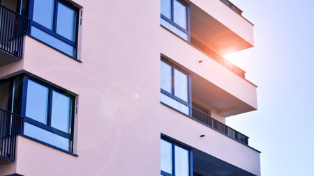 Modern luxury residential apartment. Modern apartment building on a sunny day. Apartment building with a blue sky. Facade of a modern apartment building.の写真素材
