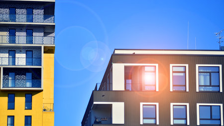 Modern luxury residential apartment. Modern apartment building on a sunny day. Apartment building with a blue sky. Facade of a modern apartment building.の写真素材