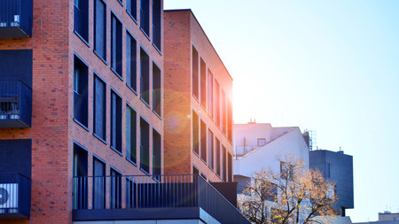 Modern luxury residential apartment. Modern apartment building on a sunny day. Apartment building with a blue sky. Facade of a modern apartment building.の写真素材