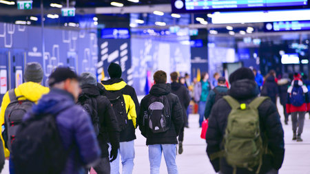 Warsaw, Poland. 28 November 2025. Commuters going through the underground passage hall at Warszawa...