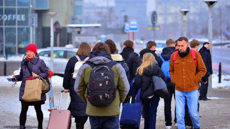 Warsaw, Poland. 15 January 2026. People walking on the street in the city on a winter cold day. Crowd of anonymous people walking on busy street. Urban street life.のeditorial素材