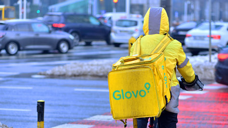 Warsaw, Poland. 15 January 2026. An unidentified Glovo bike courier seen on the street
