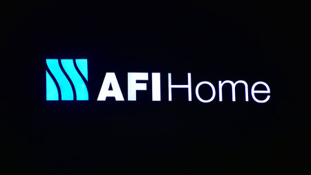 Warsaw, Poland. 21 January 2026. Urban landscape after dark. Neon sign with the inscription: AFI...