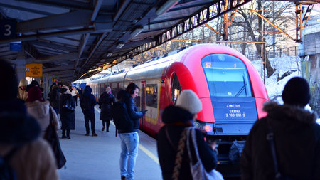 Warsaw, Poland. February 3, 2026. People and train in Warszawa Ochota Railway Station.