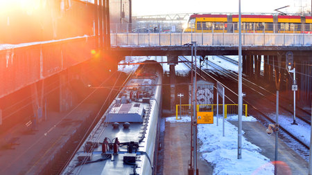 Warsaw, Poland. February 3, 2026. Modern yellow tram urban european city with public transit stop.