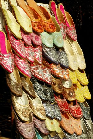 Colourful embroidered sandals on sale in a street in Jaipur, Indiaの写真素材