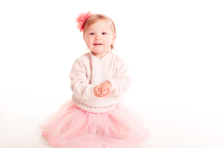 Laughing baby girl 1-2 year old having fun over white. Childhood.の写真素材