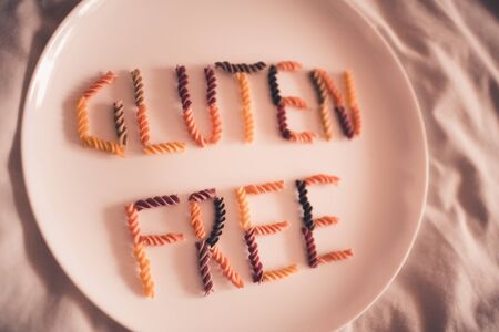 Gluten free pasta on white plate closeup. Healthy lifestyle concept. Selective focus. の写真素材