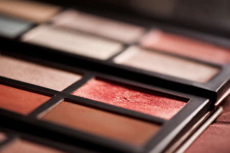 Colorful make up palette with eye shadows and blusher closeup. Selective focus.の写真素材