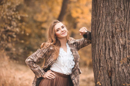 Beautiful lady girl 22-24 year old wearing vintage dress outdoors.の写真素材