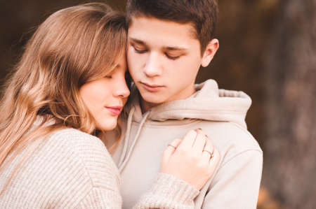 Love teenage couple 15-16 year old posing outdoors. Autumn season. 20s.の写真素材