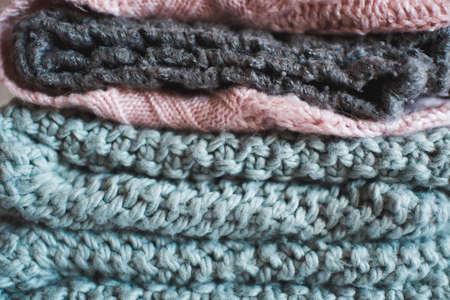 Knitted clothes texture closeup. Winter season concept.