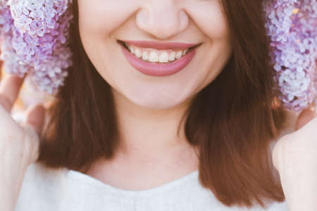 Dental smile of beautiful woman close up. Happiness. Relaxation. Happy cheerful adult girl with healthy white teeth closeup. Health care concept lifestyle.の写真素材