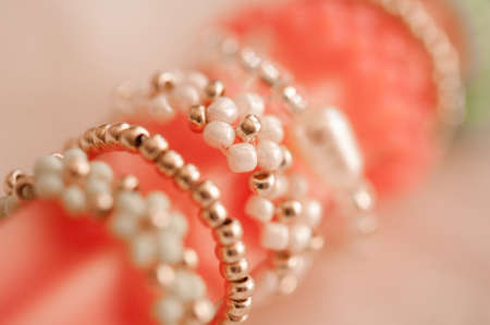 Beautiful handmade jewelery with colorful beads with flower shape in macro closeup. selective focus....