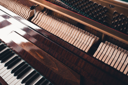Old vintage acoustic piano inside with hammers and strings close up. Tuning musical instrument. selective focus.の写真素材