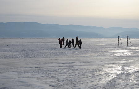 Kids on the ice of Lake Baikalの写真素材