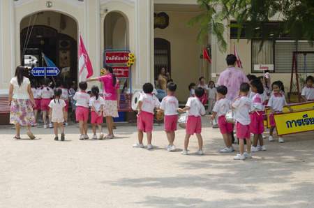 Children orchestra in the courtyard of the kindergarten. Thailand, Phuket Townのeditorial素材