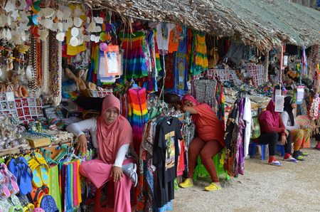 Tired tradeswoman on the Souvenir market of Sea Gypsies on the Phing Kan Island, Thailandのeditorial素材
