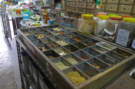 Containers with dried herbs in The Oldest Herbs Shop in the Old Town. Phuket, Thailandのeditorial素材