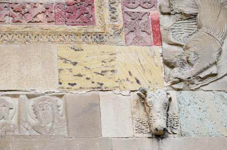 Detail facade design of the Svetitskhoveli Cathedral - stone bull heads, remains of the Basilica of V century. Mtskheta, Georgiaの写真素材