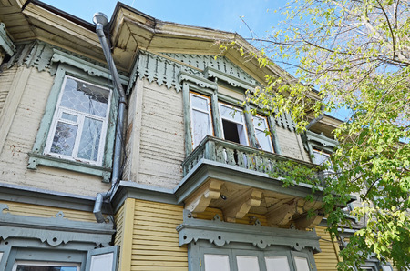 The wooden two-storey house with balcony on Irkutsk street. Russiaのeditorial素材