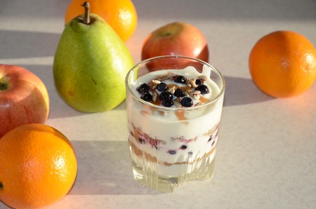 Healthy yogurt with mix of berry, sunflower seeds, bran and honey for healthy morning meal....