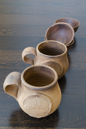Irkutsk, Russia - March, 19 2014: handmade clay mugs from the masters of the Valaam Monastery on dark backgroundのeditorial素材