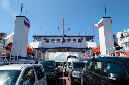 Ferry crossing cars to Olkhon Island through Olkhon Gates Strait. Lake Baikal, Russia