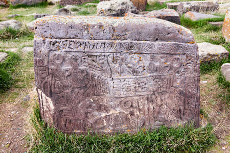Noratus, Armenia-May, 01 2019: headstone with scene from life of Armenian family. Unique lagest...