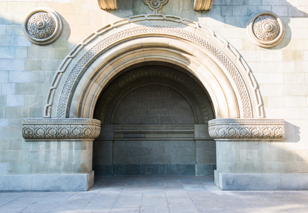 Armenian Church of St. Ripsime stands on a high hill in Yalta. Close view of arched niche under the galleryの写真素材