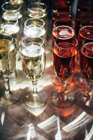 On the table there are glasses with champagne. Preparations for a grand celebrationの写真素材