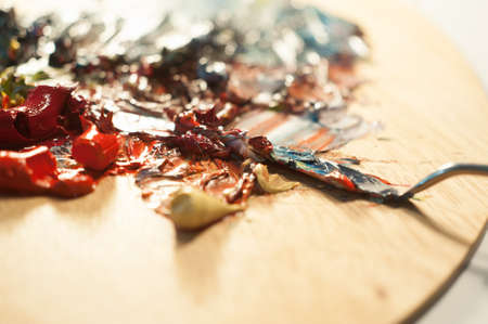 Artist oil colour palette mixing colour with a palette knife beautiful color mix creative art close up microの写真素材