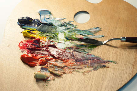 Artist oil colour palette mixing colour with a palette knife beautiful color mix creative art close up microの写真素材