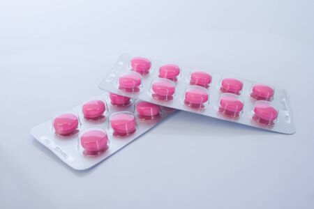 pink pill on white backgroundの写真素材