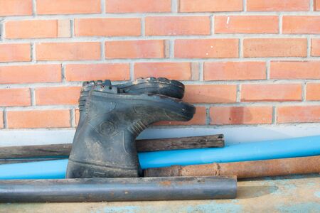 garden boot shoes with dirty mudの写真素材