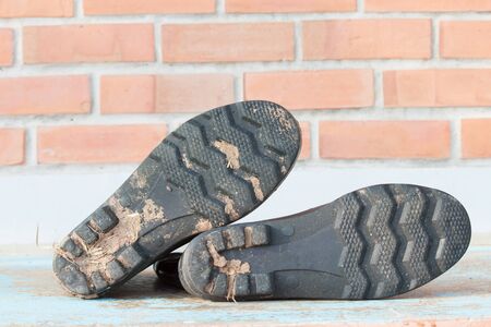 garden boot shoes with dirty mudの写真素材