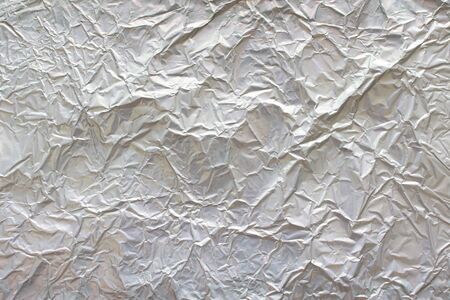 textured of crumpled matte aluminum foilの写真素材
